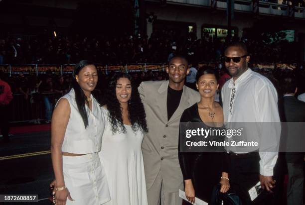 American basketball player Kobe Bryant and his sisters, Shaya Bryant and Sharia Bryant, attend the Hollywood premiere of 'Eraser', held at Mann's...