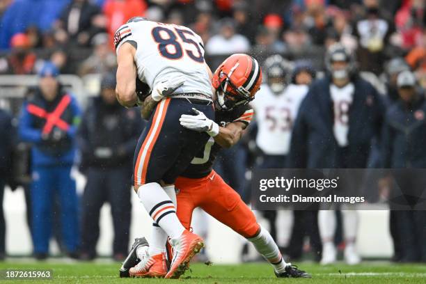 Cole Kmet of the Chicago Bears is tackled by Greg Newsome II of the Cleveland Browns during the first half at Cleveland Browns Stadium on December...