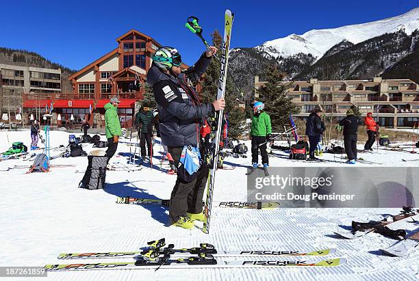 Erik Fisher collects his skis following downhill training at the U.S. Ski Team Speed Center at Copper Mountain on November 7, 2013 in Copper...