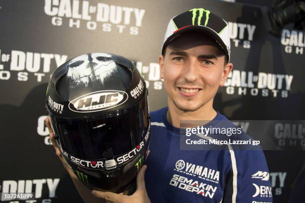 Jorge Lorenzo of Spain and Yamaha Factory Racing presents his new helmet before the press conference pre-event during the MotoGP of Valencia previews...