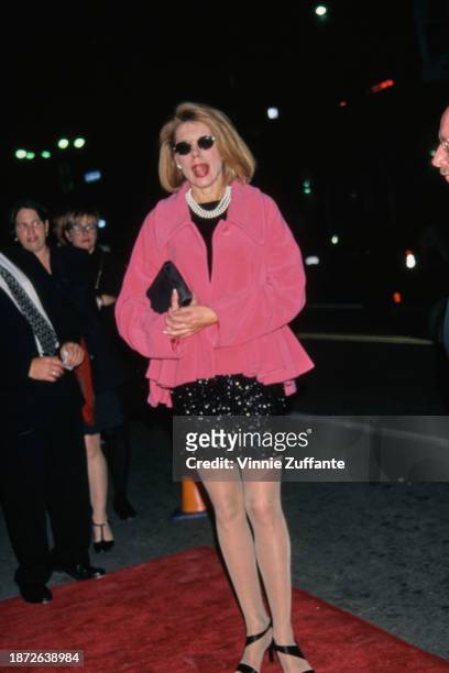 American actress and singer Christine Baranski, wearing a pink jacket over a black dress, with a multi-strand pearl necklace, attends the Westwood...