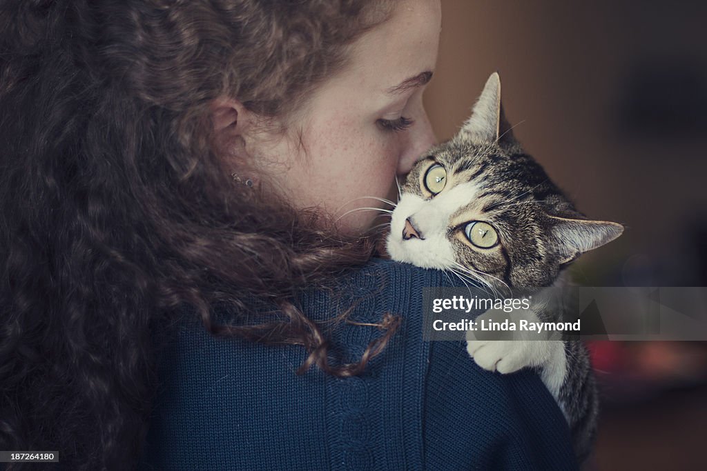 Girl holding her cat