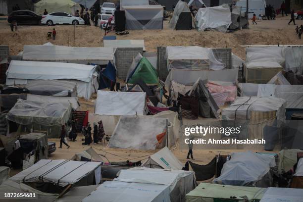 Displaced Palestinians are pictured along with makeshift tents in the so-called safe zone on December 21, 2023 in Al-Mawasi, Rafah, Gaza. Israel...