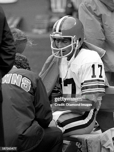 Quarerback Brian Sipe of the Cleveland Browns is attended to by trainers on the sideline during a game against the New York Jets on October 9, 1983...