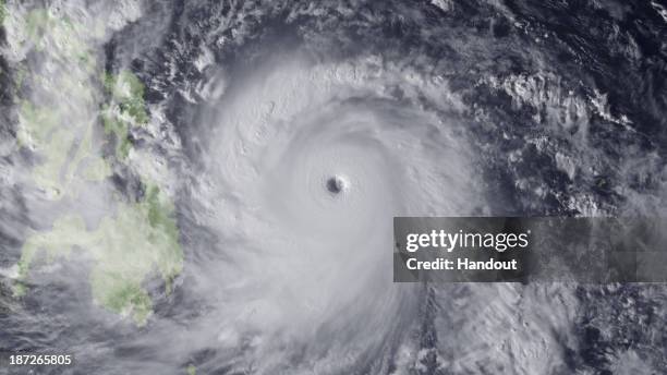 In this handout from the National Oceanic and Atmospheric Administration , Super Typhoon Haiyan moves towards the Philippines November 7, 2013 in the...