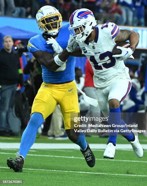 Inglewood, CA Bills wide receiver Gabe Davis hauls in second quarter touchdown pass as the Chargers Kenneth Murray defends during the second quarter...