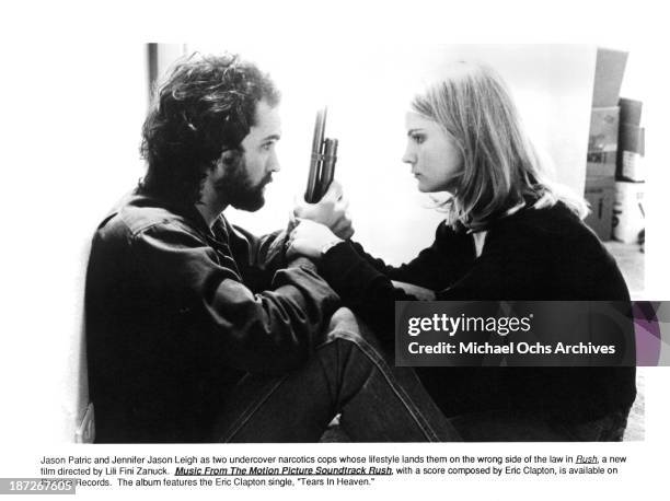 Actor Jason Patric and actress Jennifer Jason Leigh on set of the movie "Rush" in 1991.