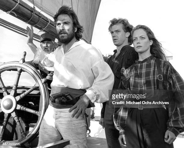 Actors Tommy Lee Jones, Michael O'Keefe and actress Jenny Seagrove on set of the Paramount Pictures movie "Savage Islands" in 1983.