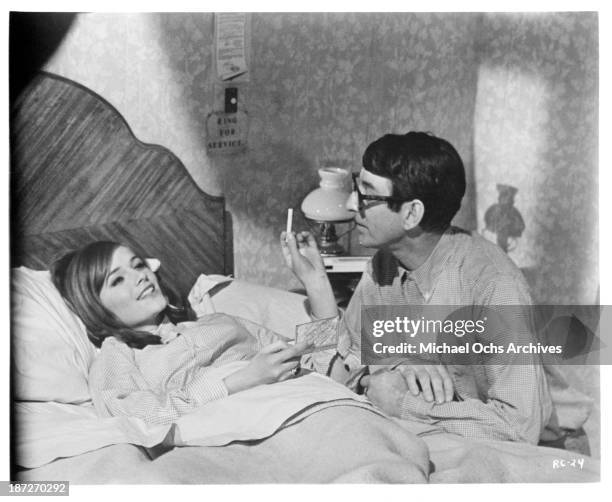 Actor Anton Rodgers and actress Charlotte Rampling on set of the movie "Rotten to the Core" in 1965.
