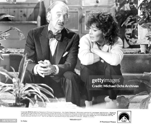 Actor David Niven and actress Lesley-Anne Down on set of the Paramount Pictures movie "Rough Cut" in 1980.