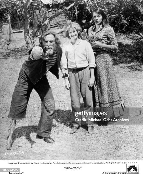 Actors Kirk Douglas and Mark Lester with actress Lesley-Anne Down on set of the Paramount Pictures movie "Scalawag" in 1973.