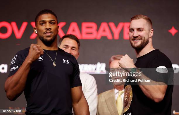 Anthony Joshua and Otto Wallin pose for a photo as they are presented by Promotor Eddie Hearn, Chairman of Matchroom Sport, and Manager and Promoter...