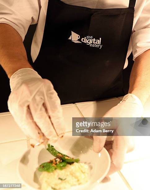 Chef prepares risotto at the Digital Eatery at the opening of the Microsoft Center Berlin on November 7, 2013 in Berlin, Germany. The Microsoft...