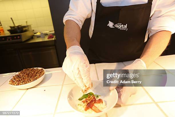 Chef prepares risotto at the Digital Eatery at the opening of the Microsoft Center Berlin on November 7, 2013 in Berlin, Germany. The Microsoft...