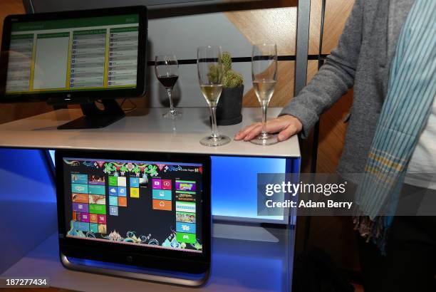 Guest stands next to Windows 8 computers at the opening of the Microsoft Center Berlin on November 7, 2013 in Berlin, Germany. The Microsoft Center...