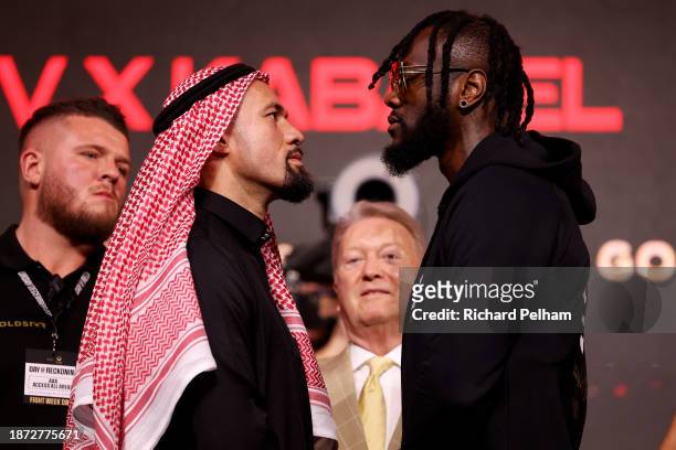 Deontay Wilder squares up with Joseph Parker as they pose for a photo during the press conference ahead of the Heavyweight fight between Deontay...