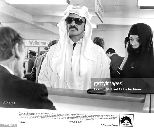 Actor Burt Reynolds and actress Lesley-Anne Down on set of the Paramount Pictures movie "Rough Cut" in 1980.