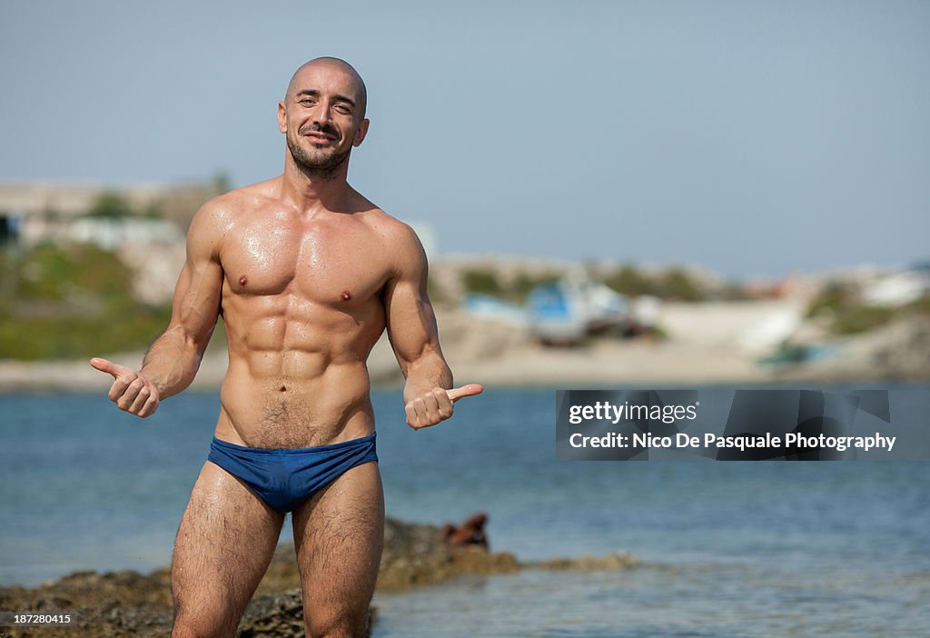 Smiling man enjoying sun at sea