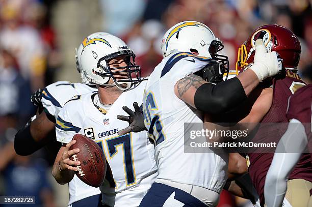 Philip Rivers of the San Diego Chargers drops back to throw a pass against the Washington Redskins during an NFL game at FedExField on November 3,...