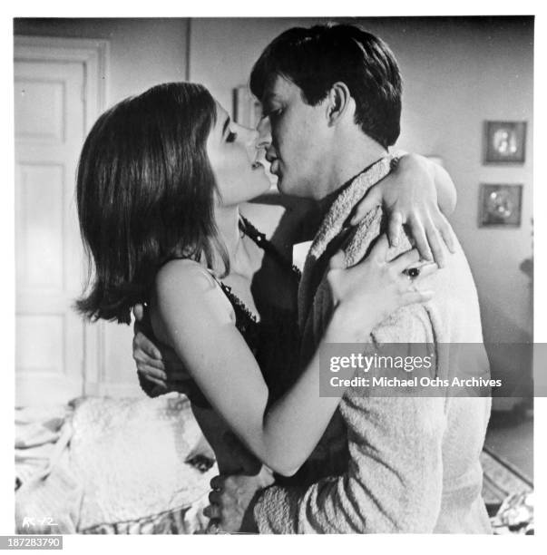 Actress Charlotte Rampling and actor Anton Rodgers on set of the movie "Rotten to the Core" in 1965.