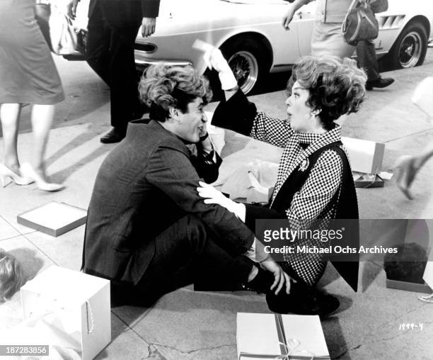 Actress Rosalind Russell and actor James Farentino on set of the Universal Studios movie "Rosie!" in 1967.