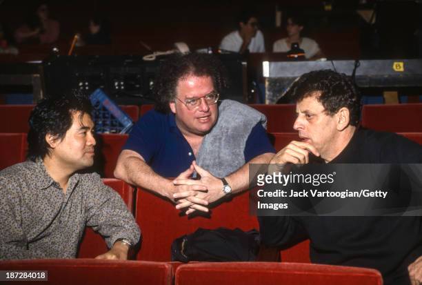 From left, librettist David Henry Hwang, Artistic Director and conductor James Levine, and composer Philip Glass confer during the final dress...