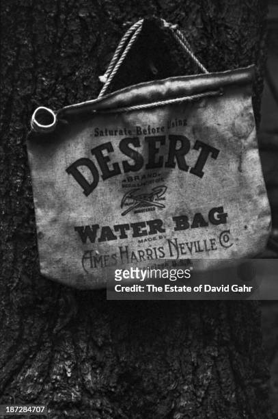Documentary portrait of an iconic Ames Harris Neville Company Desert Water Bag, owned by folk musician and banjo player Billy Faier, in August, 1964...