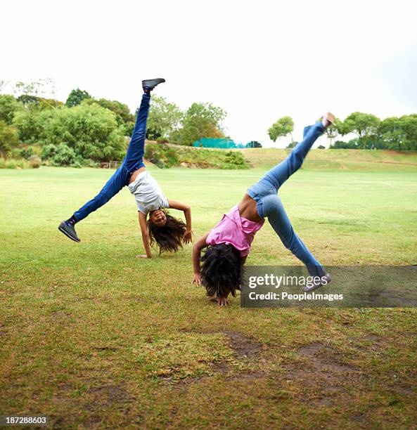 upside down fun - cartwheel stock pictures, royalty-free photos & images