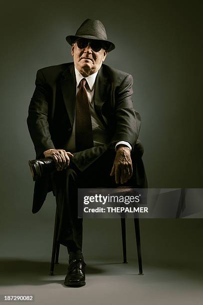 elegant senior seating - organized crime stock pictures, royalty-free photos & images