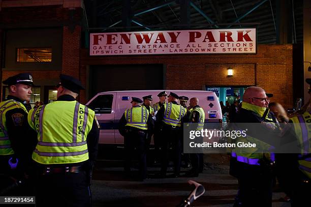 Boston Police officers gather outside of Fenway Park as the Boston Red Sox take on the Detroit Tigers in Game Six of the American League Champion...