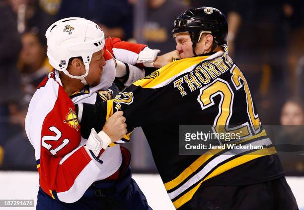 Shawn Thornton of the Boston Bruins fights Krys Barch of the Florida Panthers in the second period at TD Garden on November 7, 2013 in Boston,...