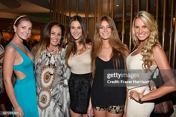 Guests pose with Designer Eva Zissu at the Aruba In Style 2013 Kick-Off party at Westin Aruba Resort on November 7, 2013 in Aruba, Aruba.