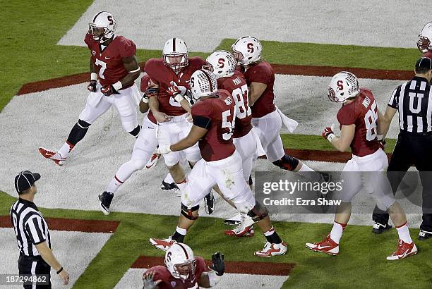 Quarterback Kevin Hogan of the Stanford Cardinal celebrates after an 11-yard touchdown run in the second quarter against the Oregon Ducks at Stanford...