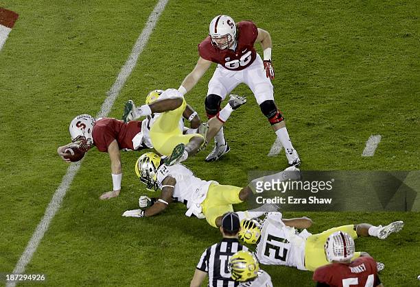 Quarterback Kevin Hogan of the Stanford Cardinal dives into the endzone to score an 11-yard touchdown run in the second quarter against the Oregon...