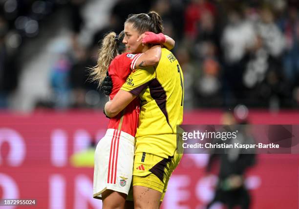 Lena Pauels of SL Benfica celebrates with teammate Lucia Alves after saving a penalty kick taken by Laura Freigang of Eintracht Frankfurt during the...