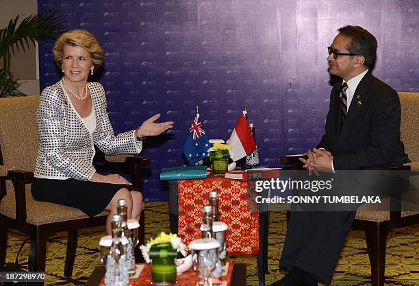 Indonesian Foreign Minister Marty Natalegawa speaks with Australian Foreign Minister Julie Bishop before a bilateral meeting at the Bali Democracy...