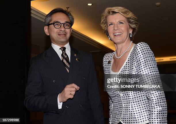 Indonesian Foreign Minister Marty Natalegawa shakes hands with Australian Foreign Minister Julie Bishop before a bilateral meeting at the Bali...