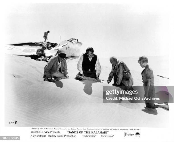Actors Nigel Davenport, Stuart Whitman,Stanley Baker, Harry Andrews and actress Susannah York on set of Paramount Pictures movie "Sands of the...