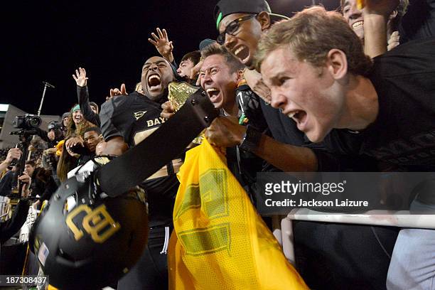 Running back Lache Seastrunk of the Baylor Bears celebrates with fans after their win against the Oklahoma Sooners on November 7, 2013 at Floyd Casey...