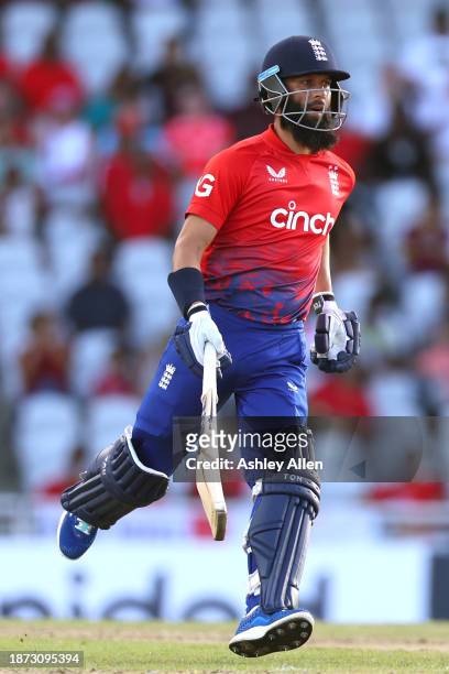 Moeen Ali of England runs between the wickets during the 5th T20 International between the West Indies and England at the Brian Lara Cricket Academy...
