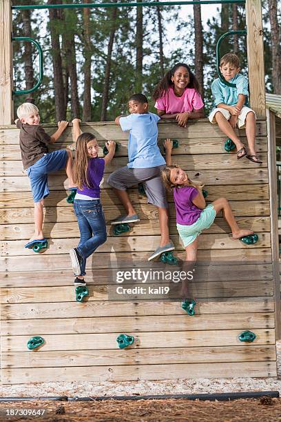 children on climbing wall - kids climbing stock pictures, royalty-free photos & images