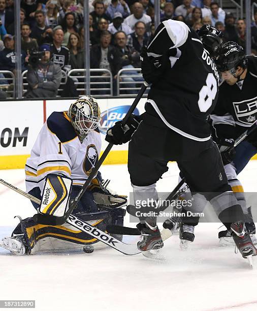 Goalie Jhnoas Enroth of the Buffalo Sabres stops a shot by Drew Doughty of the Los Angeles Kings at Staples Center on November 7, 2013 in Los...