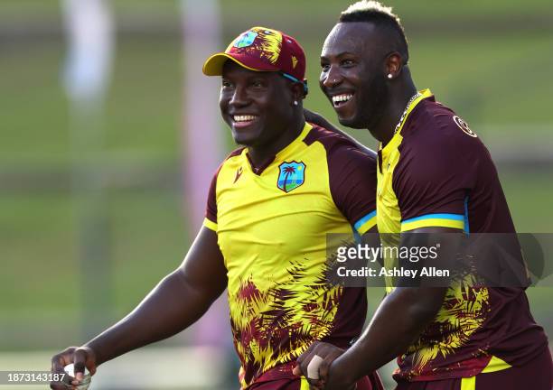 Rovman Powell and Andre Russell of West Indies celebrate the wicket of Moeen Ali during the 5th T20 International between the West Indies and England...