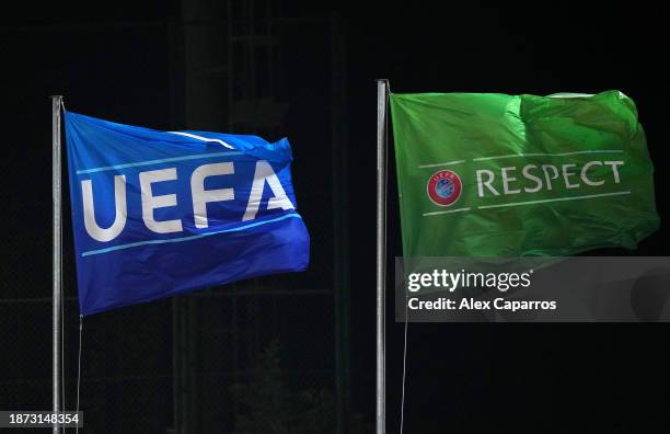Flags displaying the 'UEFA' and 'UEFA Respect' logos are seen during the UEFA Women's Champions League group stage match between FC Barcelona and FC...