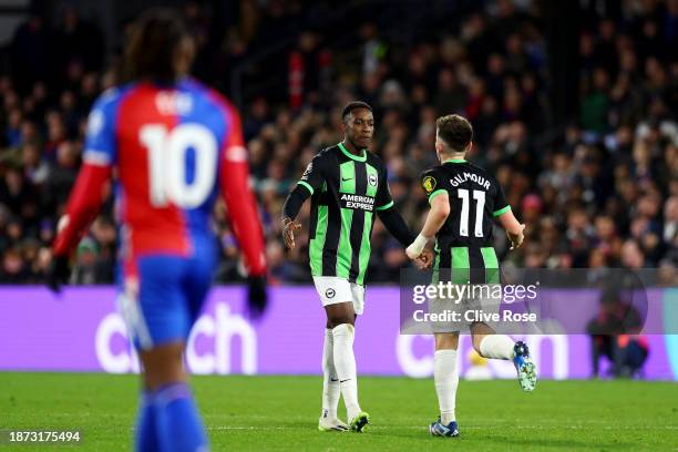 Danny Welbeck of Brighton & Hove Albion celebrates with teammate Billy Gilmour after scoring their team's first goal during the Premier League match...