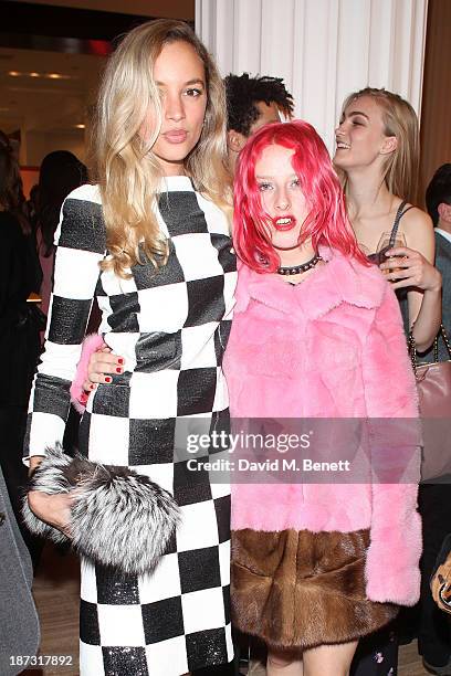 Phoebe Collings-James and Harriet Varney attend the launch of Louis Vuitton Townhouse at Selfridges on November 7, 2013 in London, England.