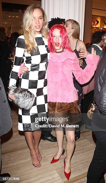 Phoebe Collings-James and Harriet Varney attend the launch of Louis Vuitton Townhouse at Selfridges on November 7, 2013 in London, England.