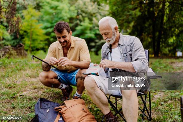 father and son camping - grandpa son stock pictures, royalty-free photos & images