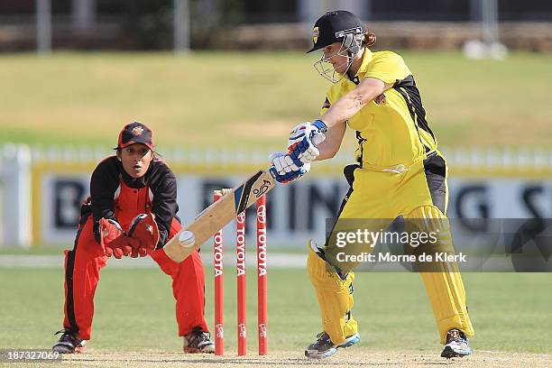 Jenny Wallace of the Fury bats in front of Alicia Dean of the Scorpions during the WT20 match between South Australia and Western Australia on...