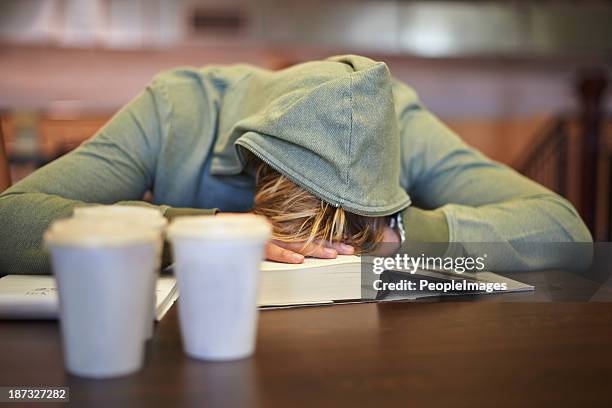 feeling the strain of looming exams - tired stockfoto's en -beelden
